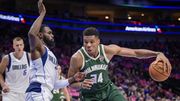Dallas Mavericks guard Tim Hardaway Jr. (11) defends against Milwaukee Bucks forward Giannis Antetokounmpo (34)